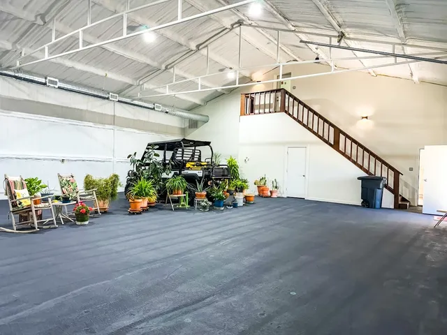 a view of a garage with a bike and table