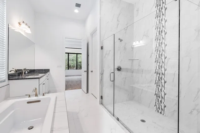 a bathroom with a bathtub and a sink