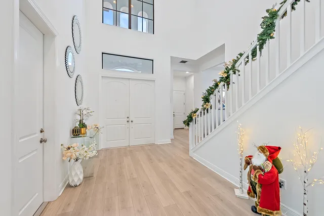 a view of entryway with wooden floor