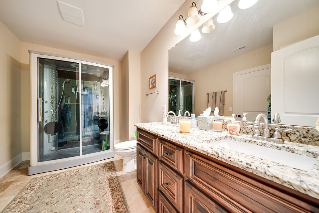5751 Pinewood Road Franklin, TN 37064 - Photo 20 of 50 a kitchen with a sink cabinets and window