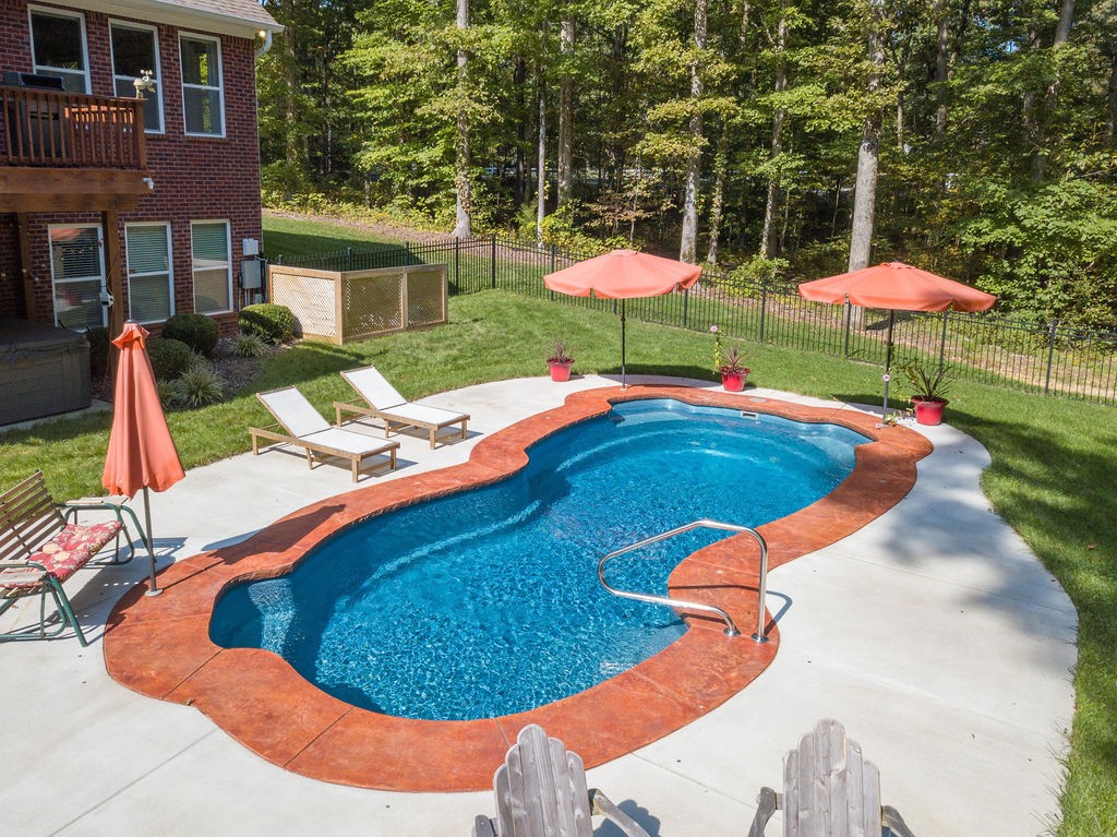 5751 Pinewood Road Franklin, TN 37064 - Photo 45 of 50 a view of a swimming pool with a yard and table