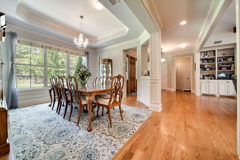 5751 Pinewood Road Franklin, TN 37064 - Photo 8 of 50 a view of a dining room with furniture window and wooden floor