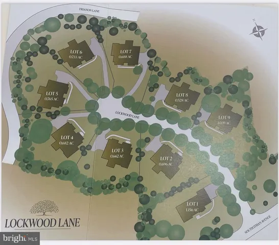 a view of a brick house with many windows and a yard