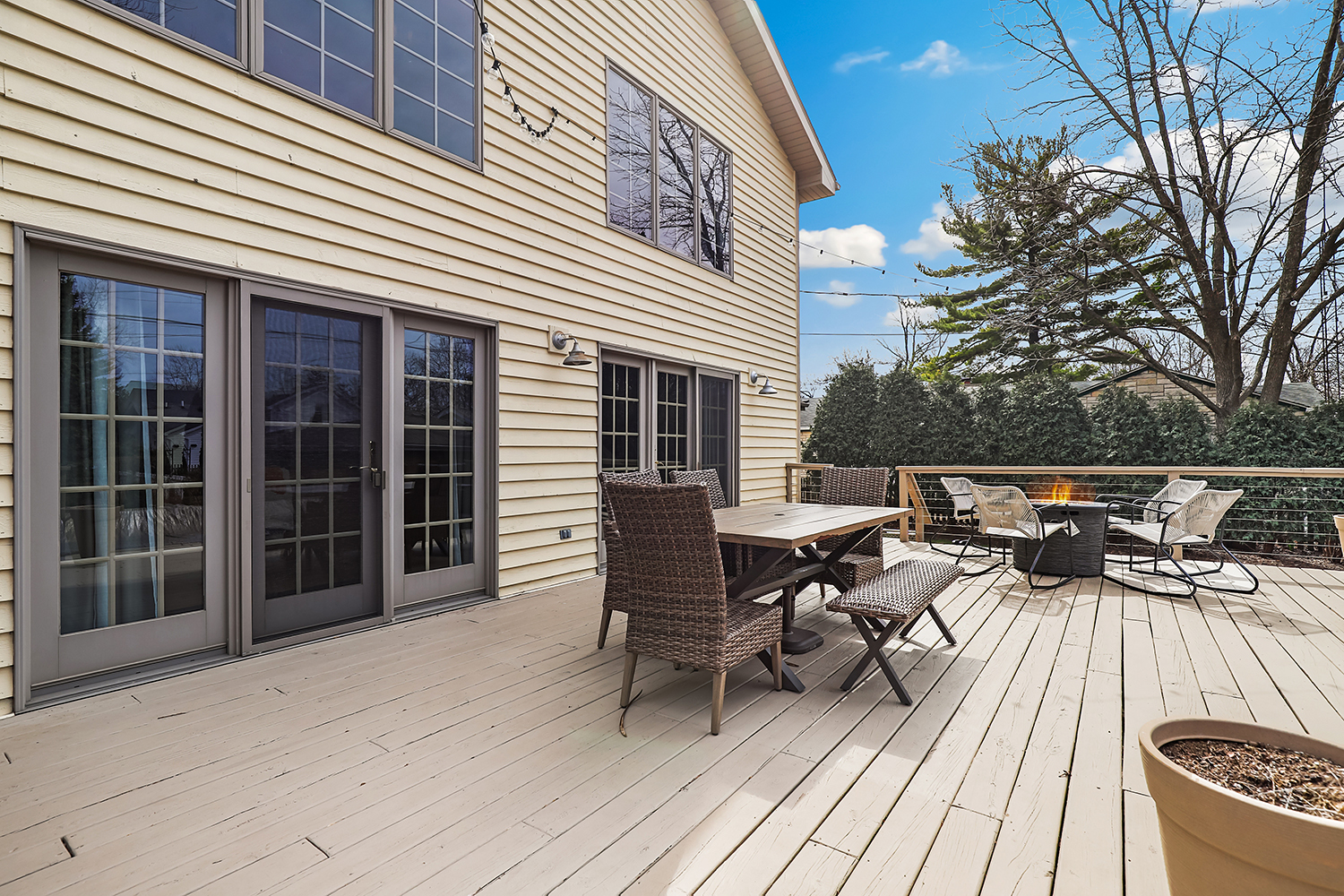 114 Hickory Street Frankfort, IL 60423 - Photo 34 of 46 a view of a roof deck with table and chairs a barbeque with wooden floor and fence