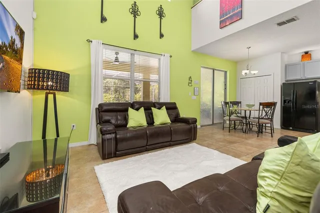 a en suite bathroom with a granite countertop sink and a mirror