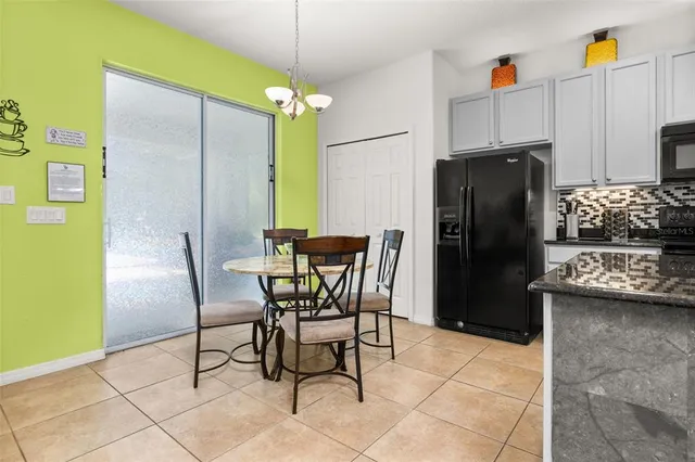 a bedroom with a bed a dresser and a window