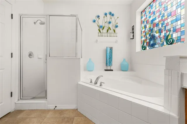 an aerial view of lake and residential houses with outdoor space