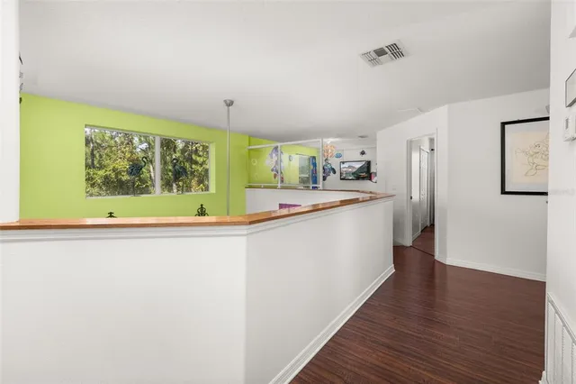 a view of a swimming pool with a patio and a yard