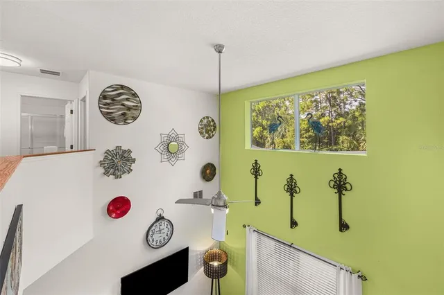 a view of a house with swimming pool and sitting area