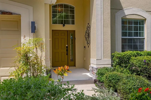 a view of a dining room with furniture and a window