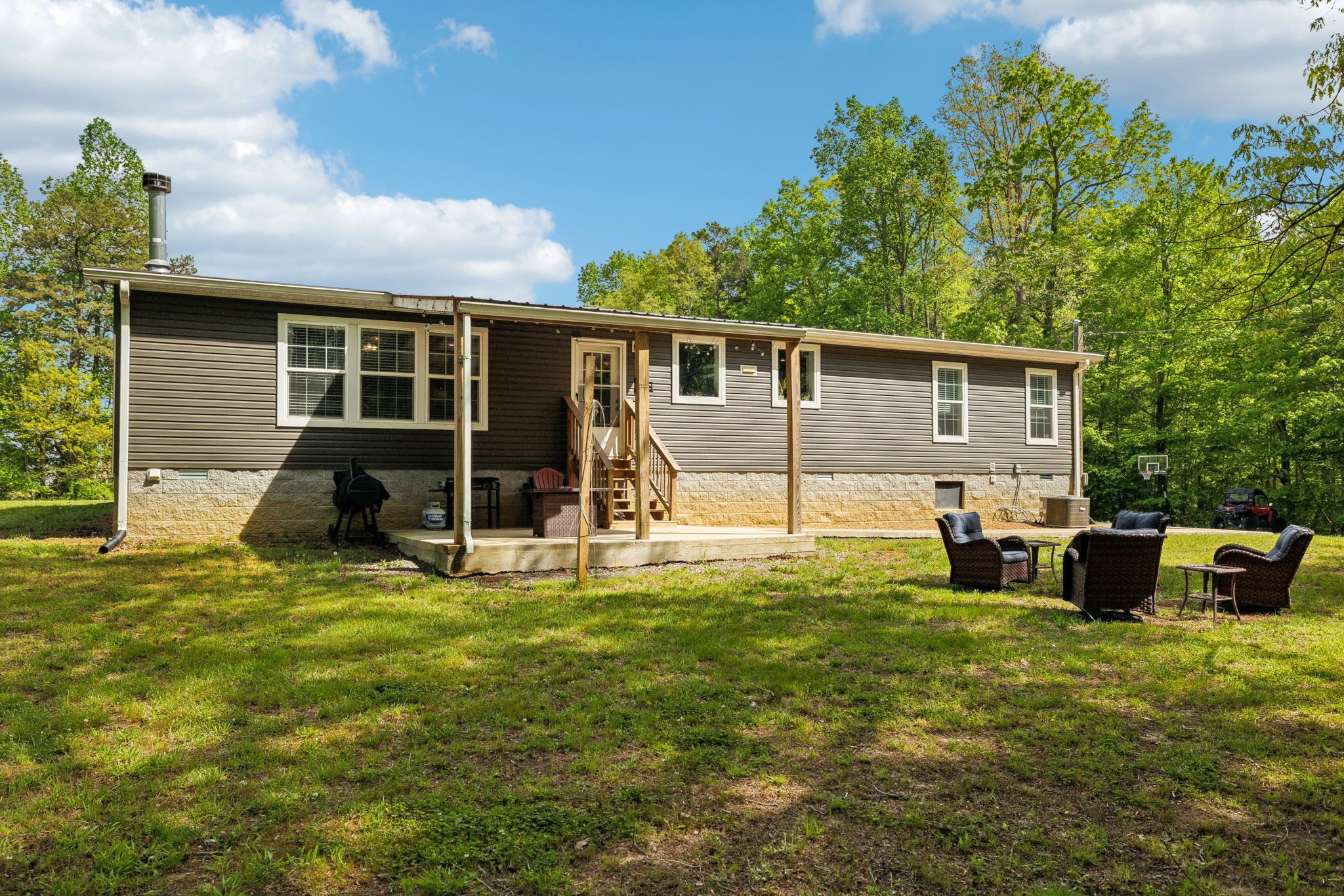 2182 New Home Road Smithville, TN 37166 - Photo 44 of 67 a view of a house with a yard and chairs