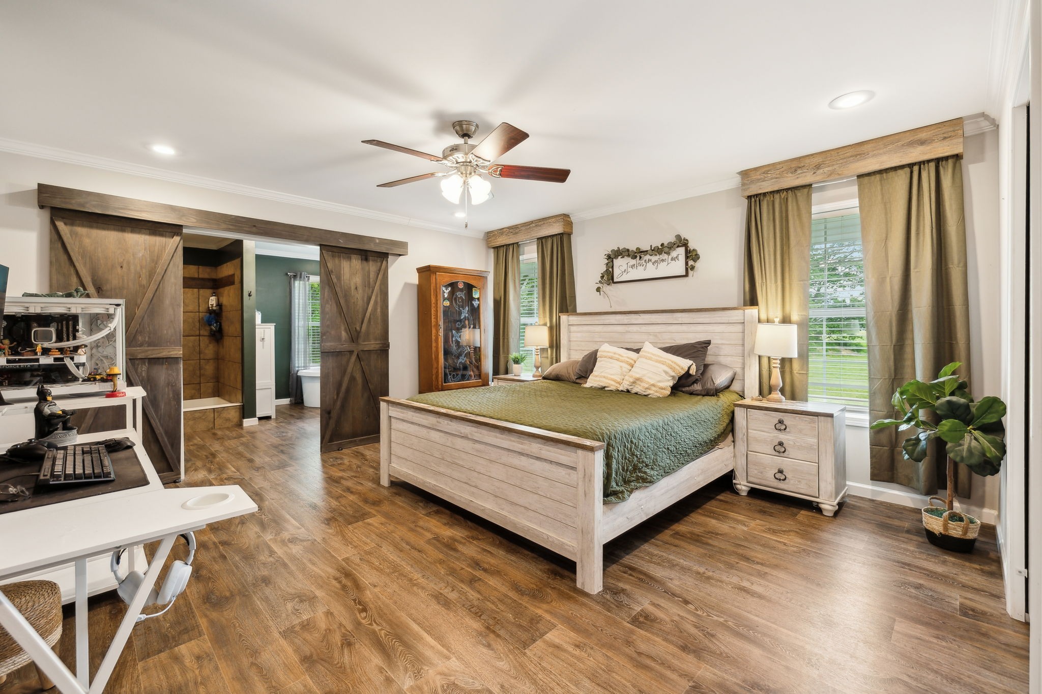 2182 New Home Road Smithville, TN 37166 - Photo 10 of 67 a bedroom with a large bed and a chandelier