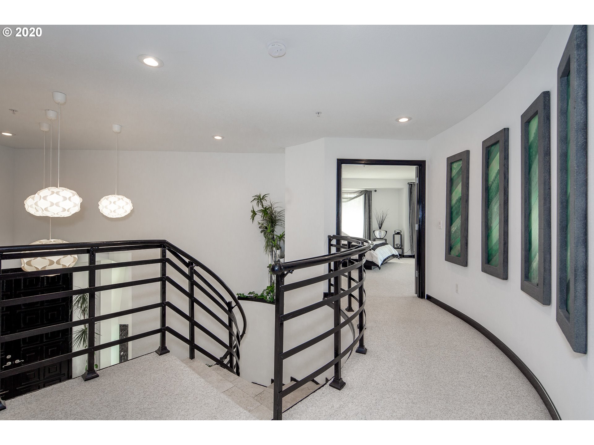 10301 Southeast Crescent Ridge Loop Happy Valley, OR 97086 - Photo 17 of 32 a view of a hallway with seating area