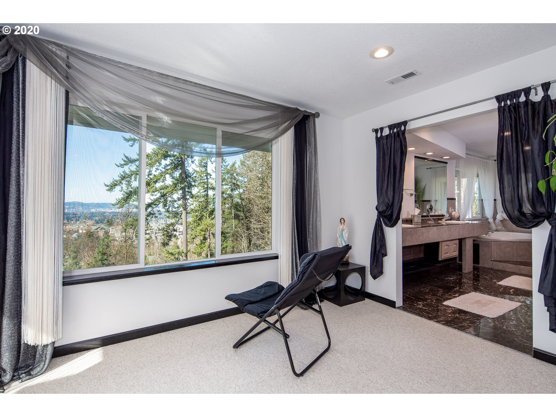 10301 Southeast Crescent Ridge Loop Happy Valley, OR 97086 - Photo 18 of 32 a view of a livingroom with furniture and a window