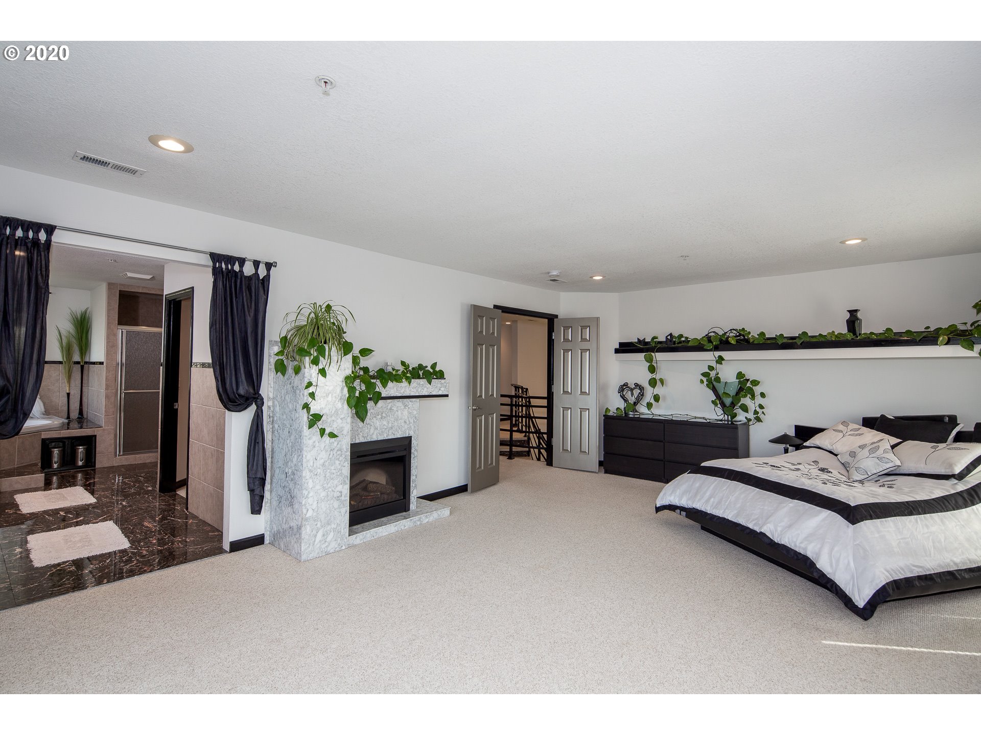 10301 Southeast Crescent Ridge Loop Happy Valley, OR 97086 - Photo 20 of 32 a living room with furniture and flowers