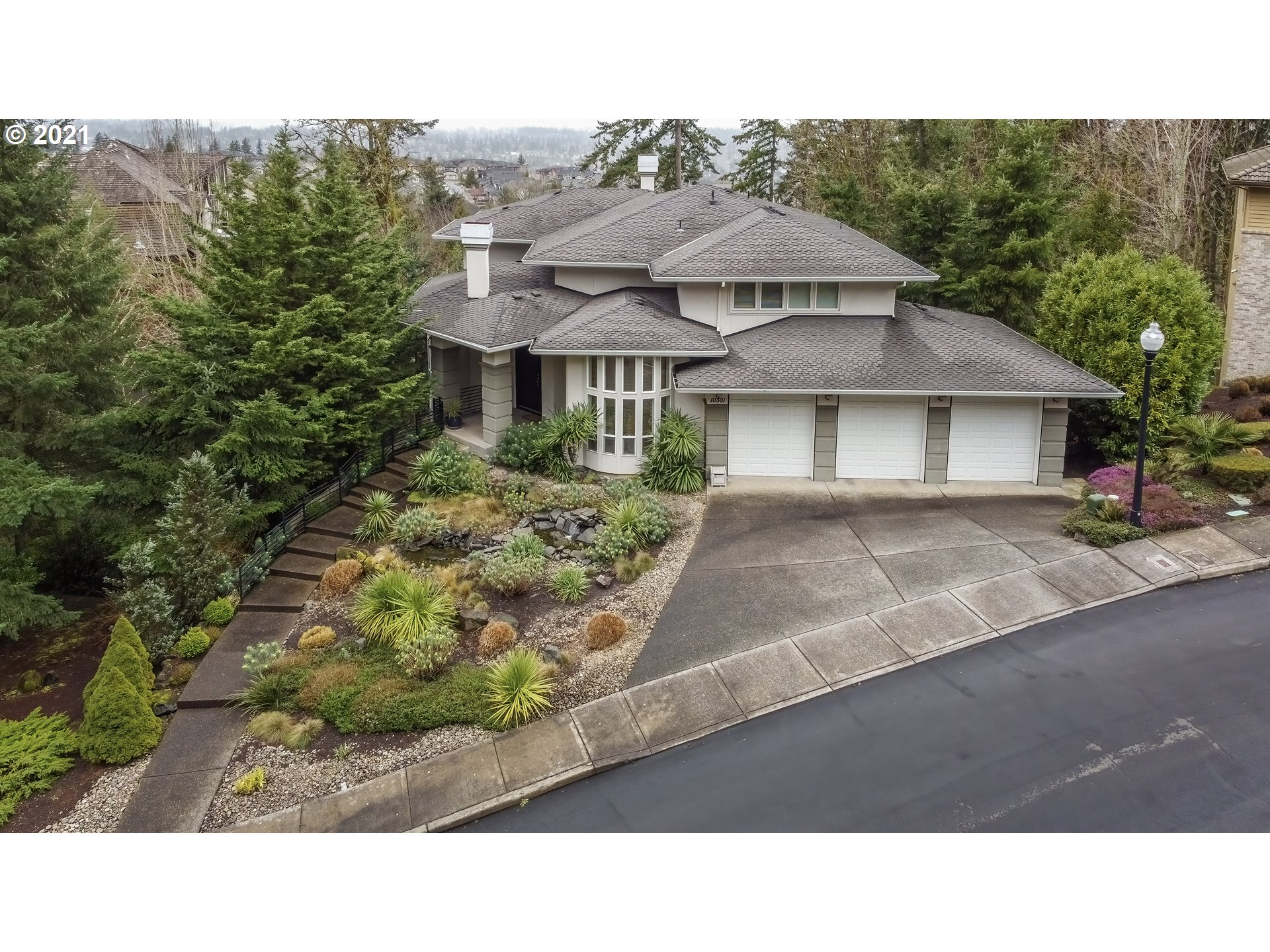 10301 Southeast Crescent Ridge Loop Happy Valley, OR 97086 - Photo 2 of 32 a black and white photo of a house