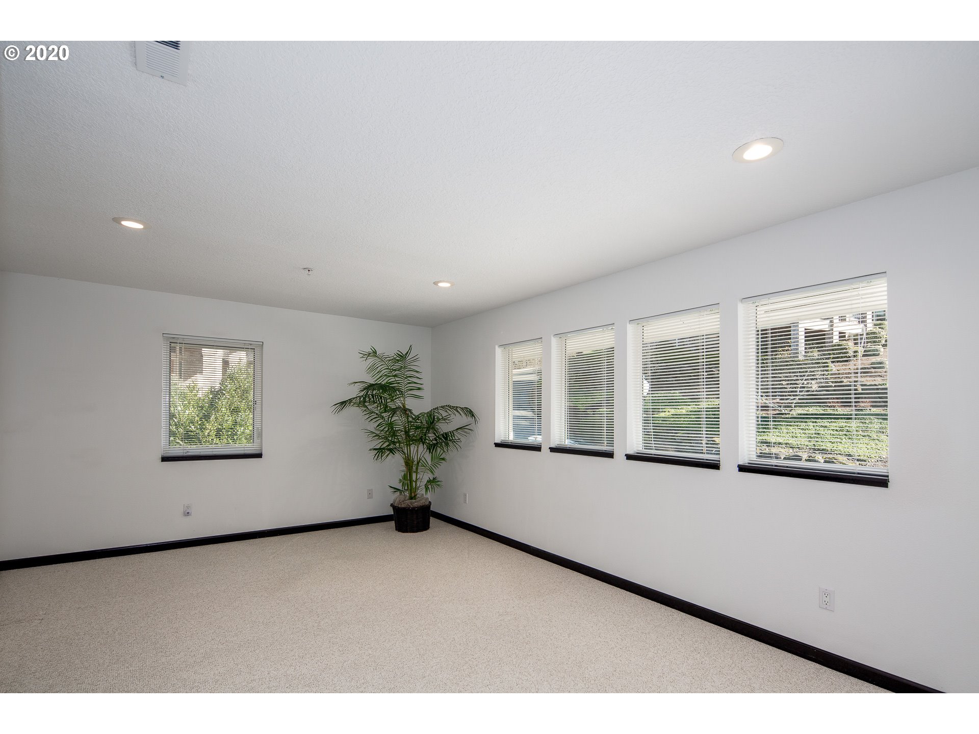 10301 Southeast Crescent Ridge Loop Happy Valley, OR 97086 - Photo 23 of 32 a living room with furniture and windows
