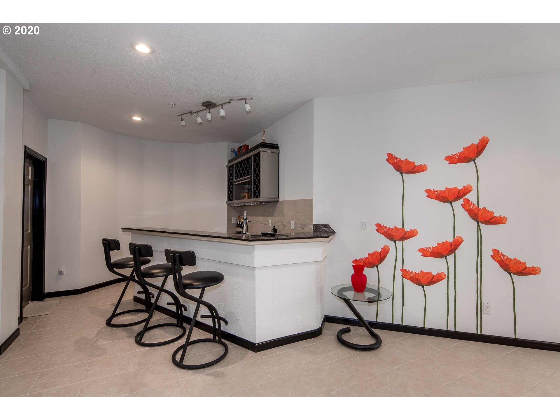 10301 Southeast Crescent Ridge Loop Happy Valley, OR 97086 - Photo 24 of 32 a workspace with furniture and white walls