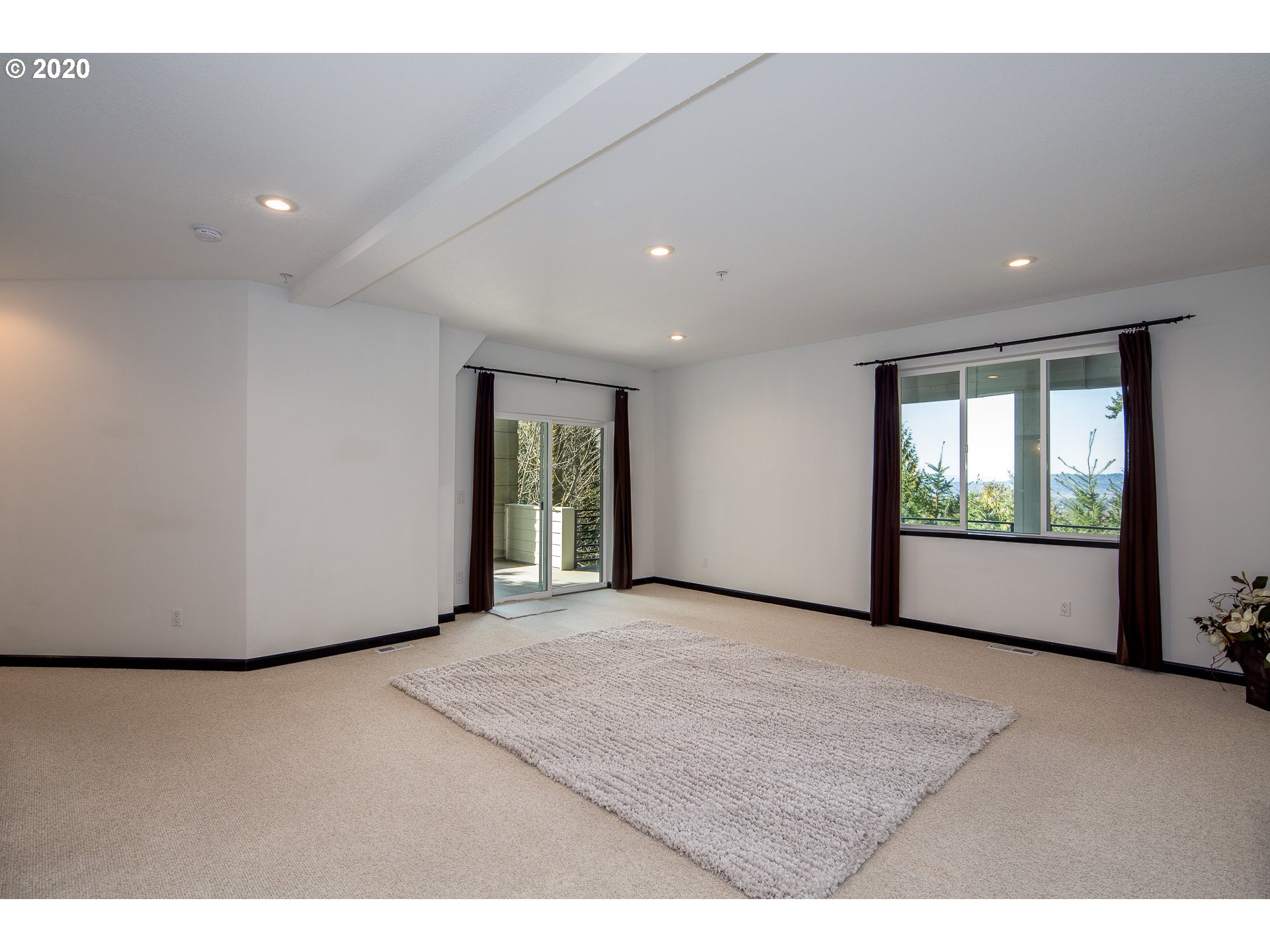 10301 Southeast Crescent Ridge Loop Happy Valley, OR 97086 - Photo 26 of 32 a view of an empty room with a window