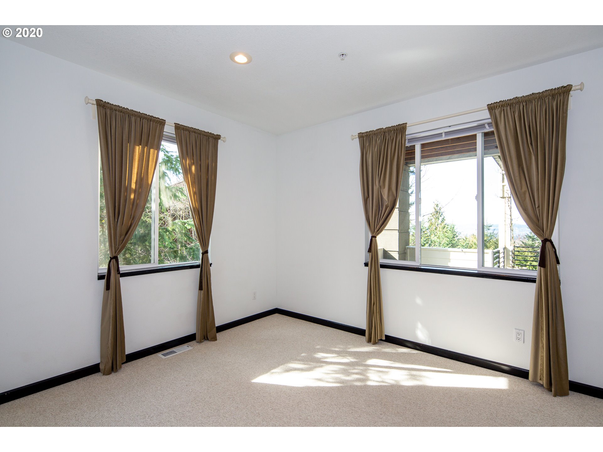 10301 Southeast Crescent Ridge Loop Happy Valley, OR 97086 - Photo 27 of 32 a view of a livingroom with wooden floor and a window