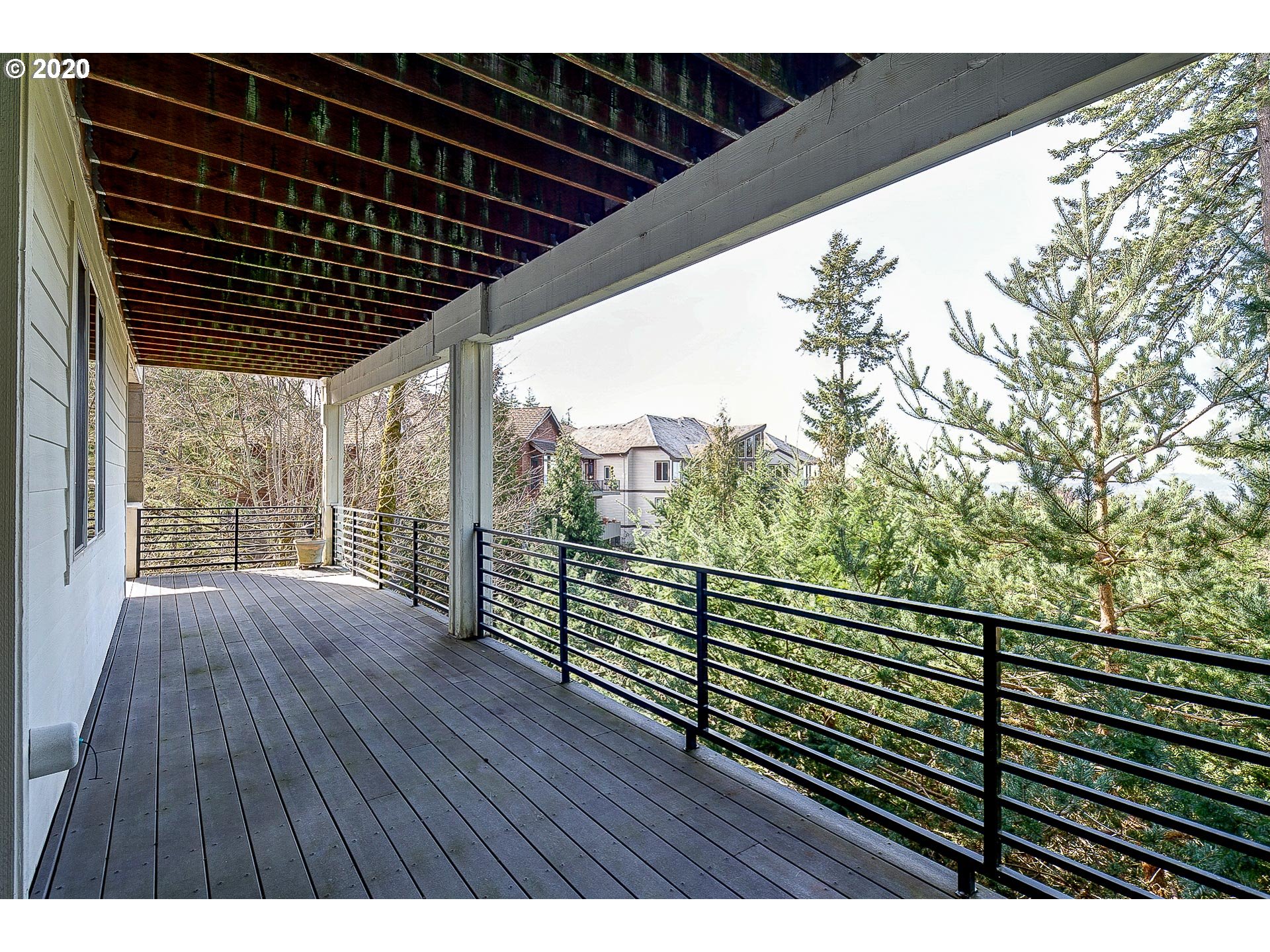 10301 Southeast Crescent Ridge Loop Happy Valley, OR 97086 - Photo 29 of 32 a view of balcony with floor to ceiling window
