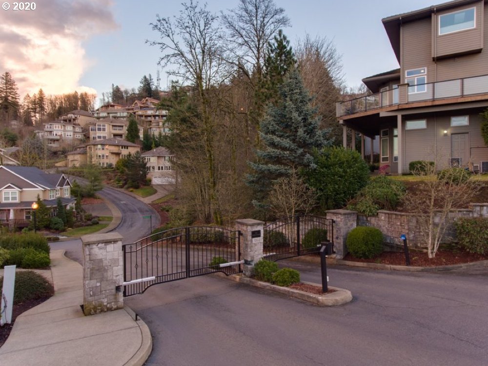 10301 Southeast Crescent Ridge Loop Happy Valley, OR 97086 - Photo 32 of 32 a view of a patio with a table and chairs
