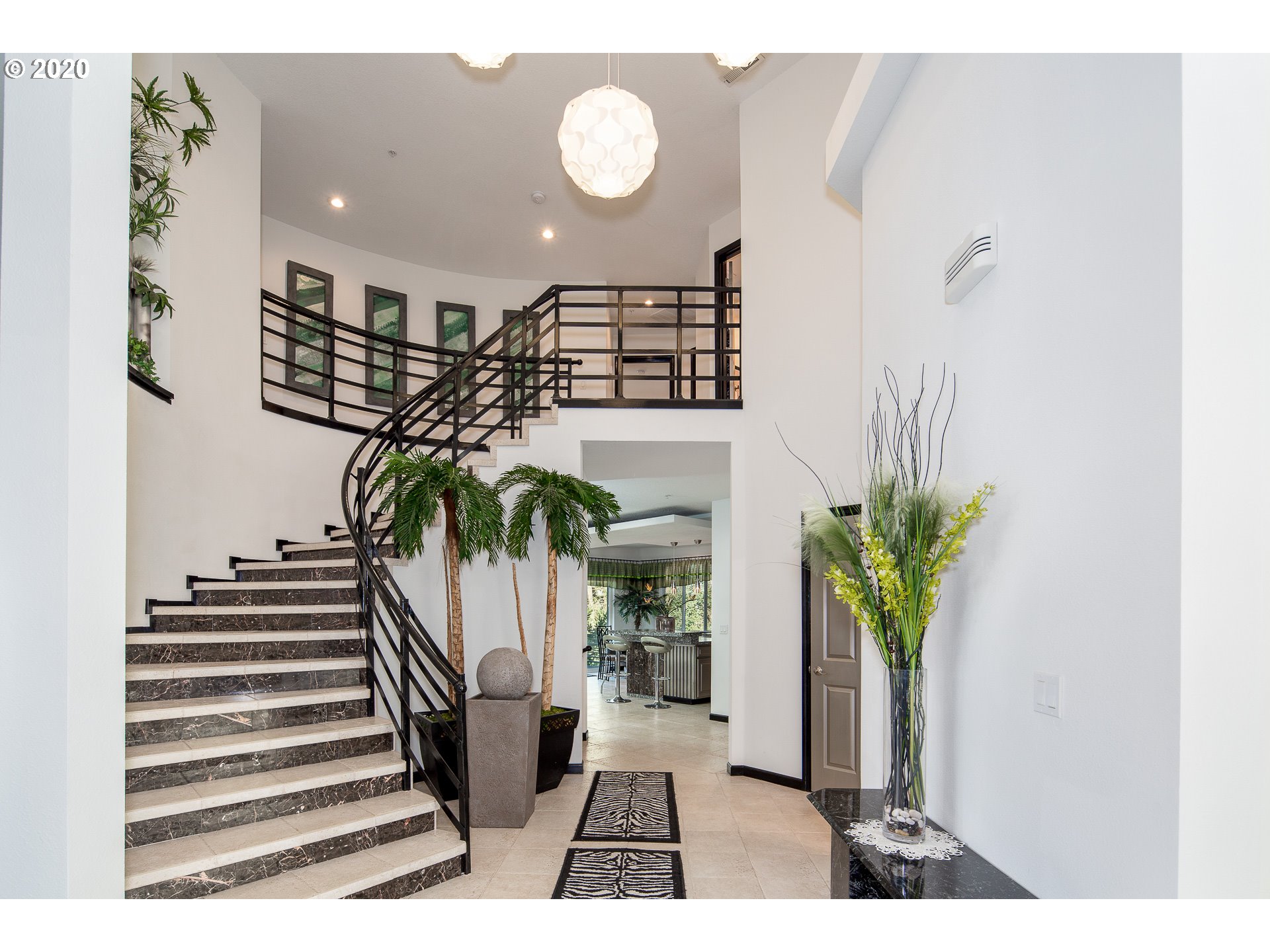 10301 Southeast Crescent Ridge Loop Happy Valley, OR 97086 - Photo 4 of 32 a view of entryway and hall with wooden floor