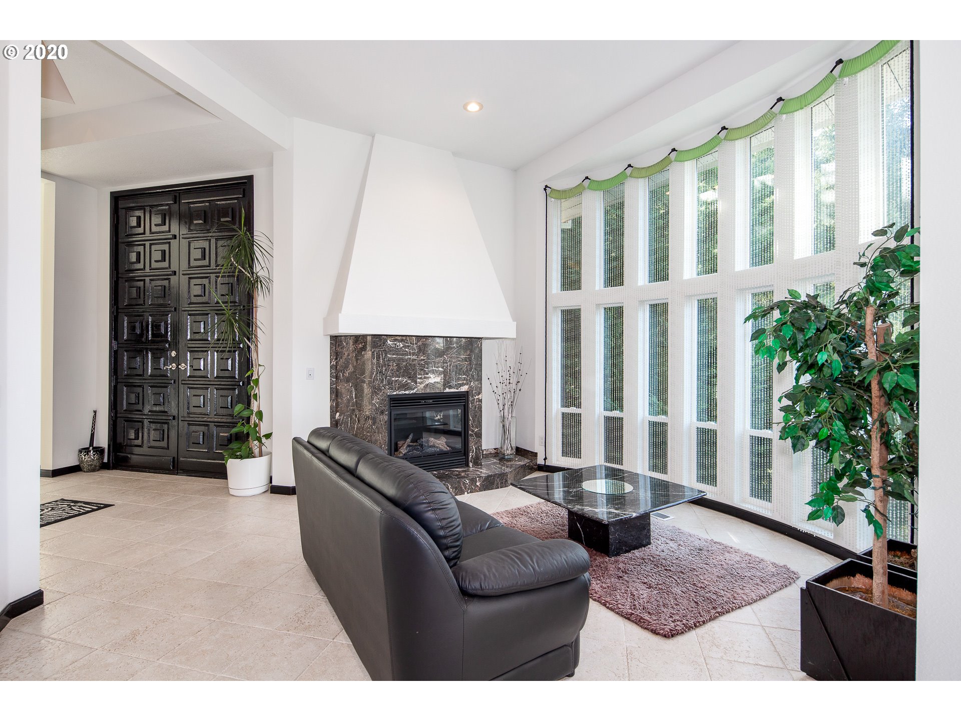 10301 Southeast Crescent Ridge Loop Happy Valley, OR 97086 - Photo 5 of 32 a living room with furniture and a fireplace