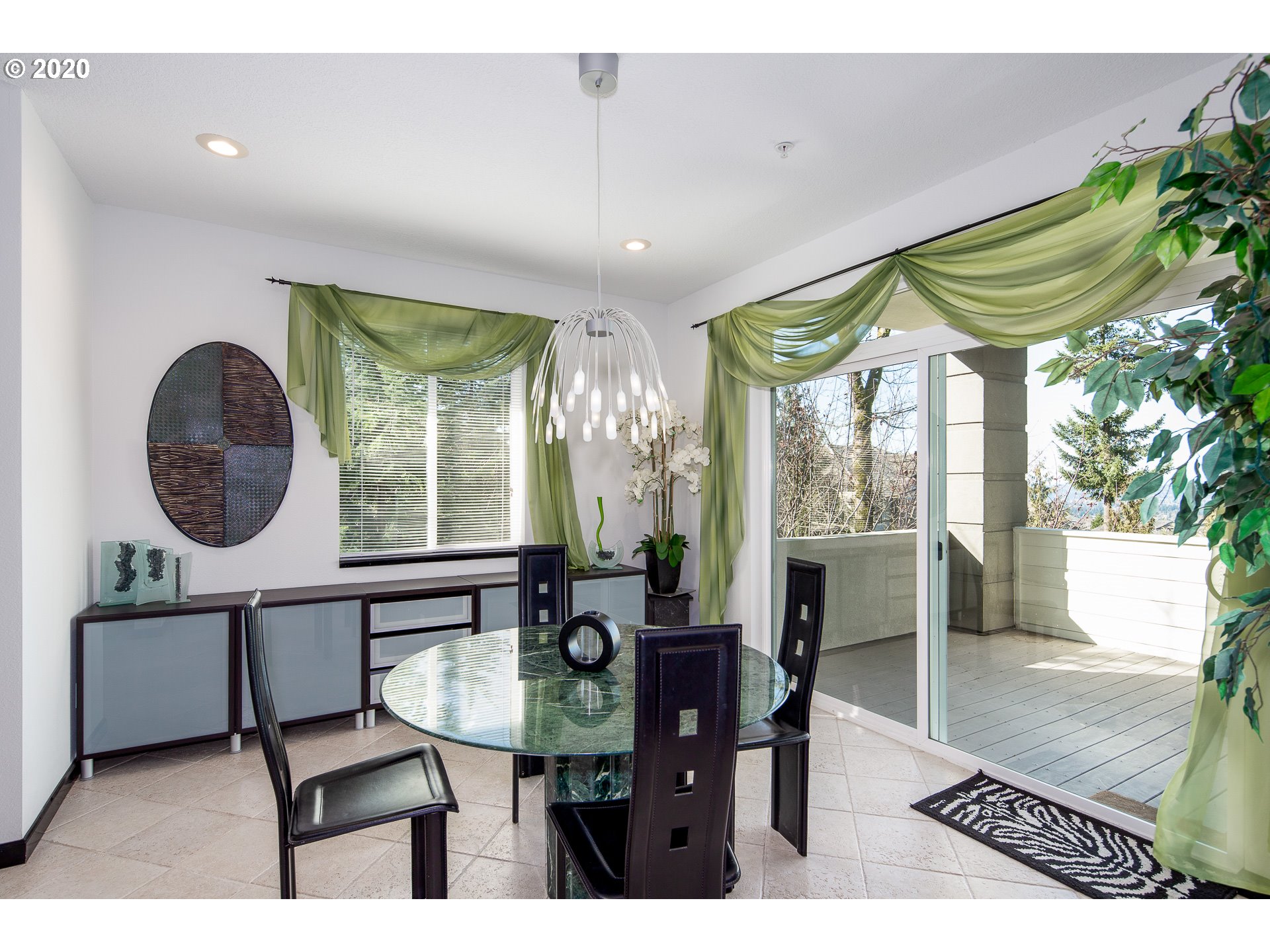 10301 Southeast Crescent Ridge Loop Happy Valley, OR 97086 - Photo 6 of 32 a dining room with furniture and a large window