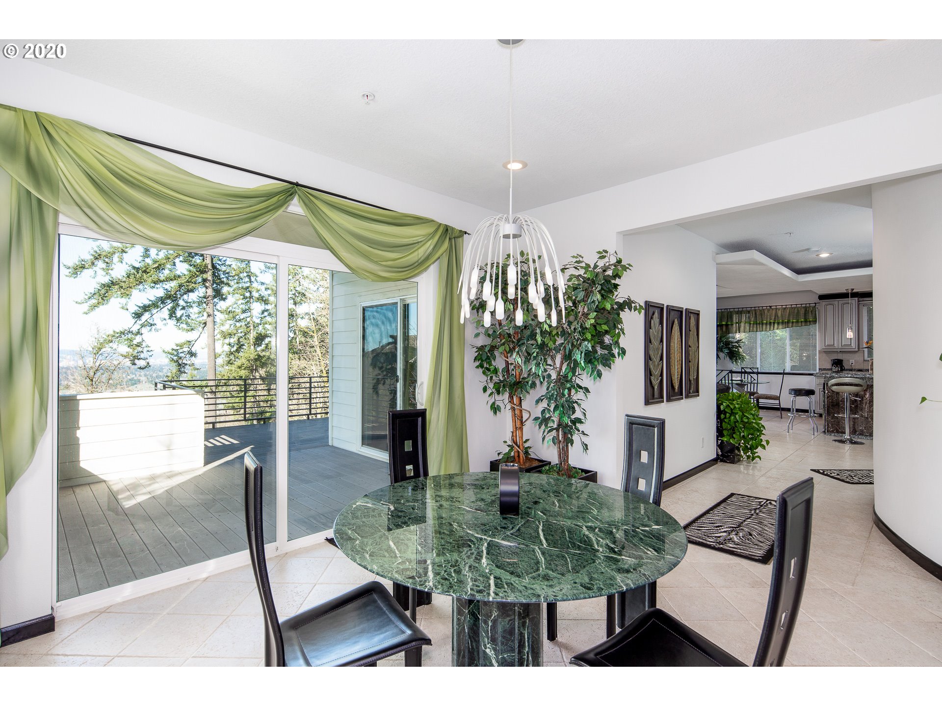 10301 Southeast Crescent Ridge Loop Happy Valley, OR 97086 - Photo 7 of 32 a living room with furniture and a table
