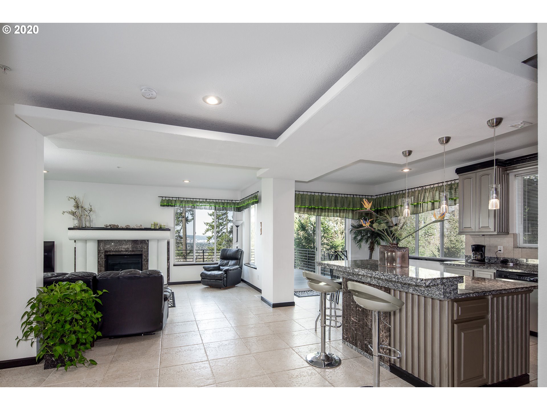 10301 Southeast Crescent Ridge Loop Happy Valley, OR 97086 - Photo 10 of 32 a living room with furniture and a fireplace