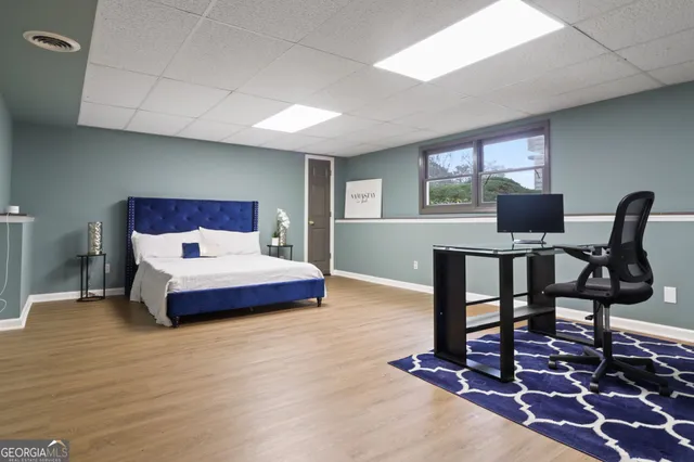 a room with chairs and wooden floor