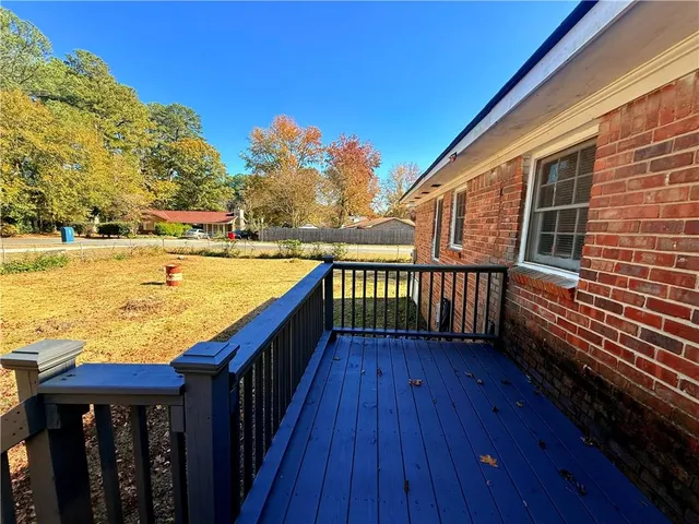 a view of deck with wooden floor and outdoor seating