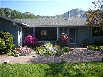 6854 Rodeo Drive Sanger, CA 93657 - Photo 1 of 9 Lush landscaping abounds. Home is on a hilltop that looks out on the Sierras.