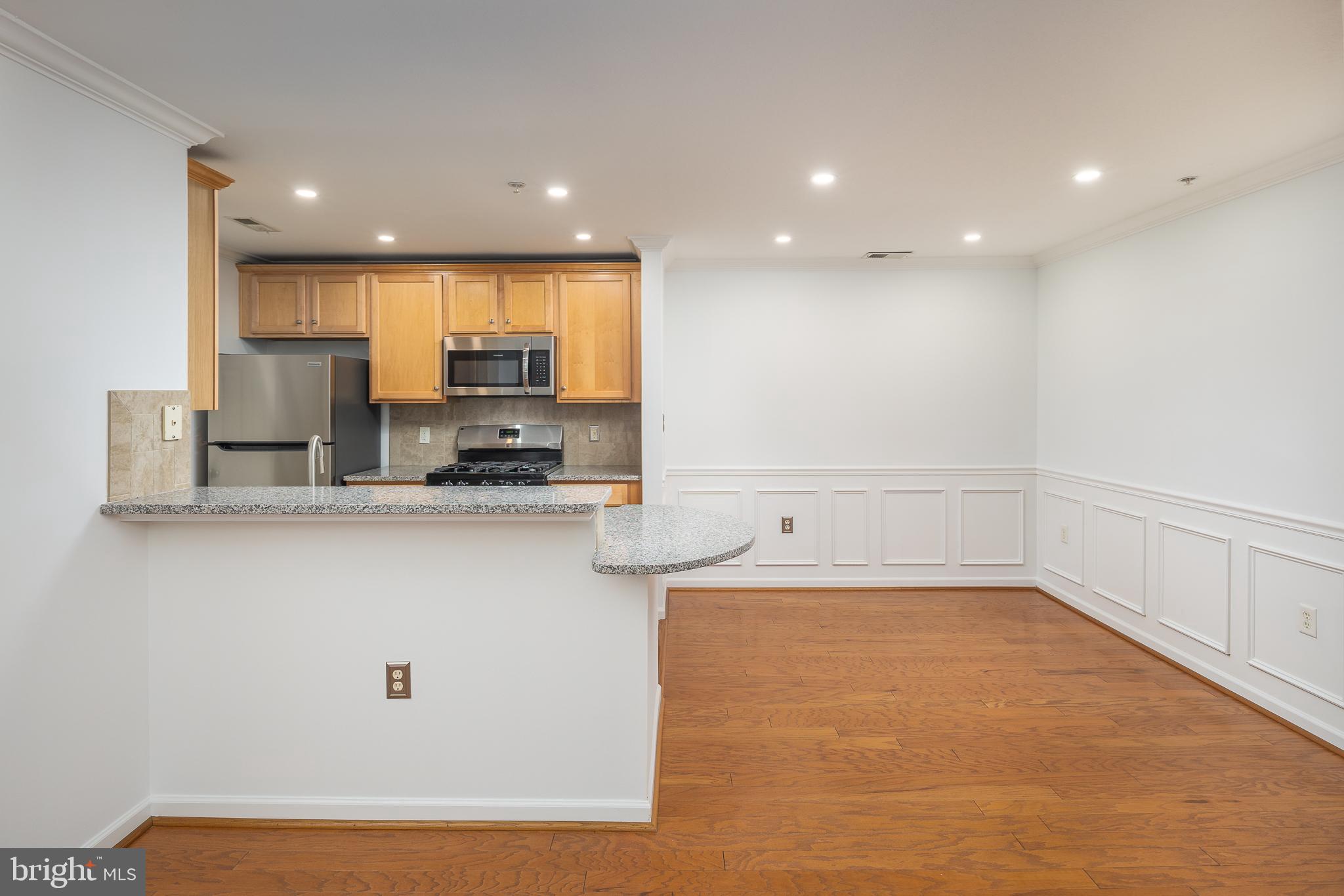 512 Sunset View Terrace Southeast, Unit 402 Leesburg, VA 20175 - Photo 11 of 30 a view of kitchen with center island and stainless steel appliances