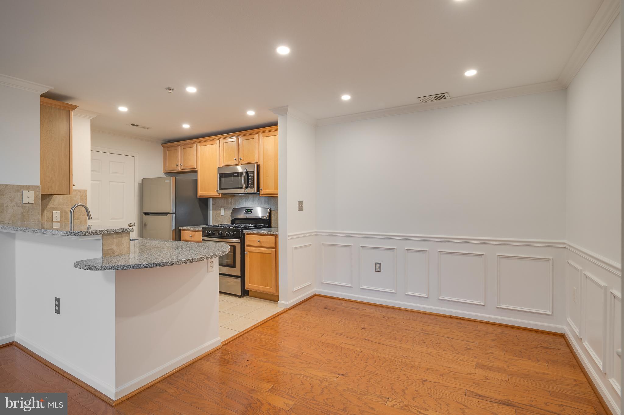 512 Sunset View Terrace Southeast, Unit 402 Leesburg, VA 20175 - Photo 12 of 30 a view of kitchen with center island and stainless steel appliances