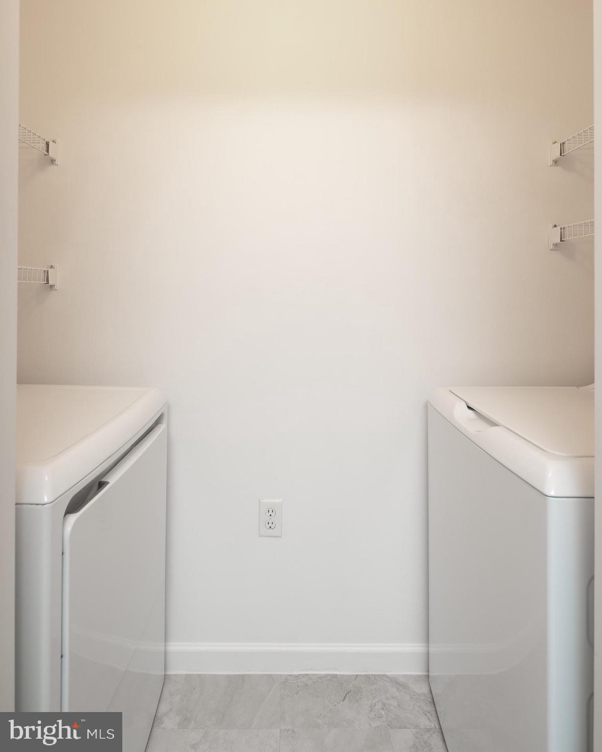 512 Sunset View Terrace Southeast, Unit 402 Leesburg, VA 20175 - Photo 15 of 30 a utility room with dryer and washer