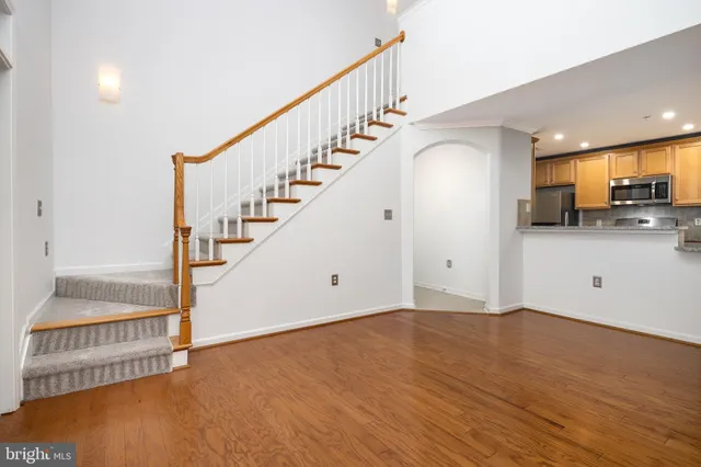 a view of kitchen with center island and stainless steel appliances
