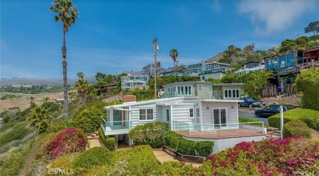 122 Spindrift Lane Rancho Palos Verdes, CA 90275 - Photo 3 of 17 a front view of a house with a garden