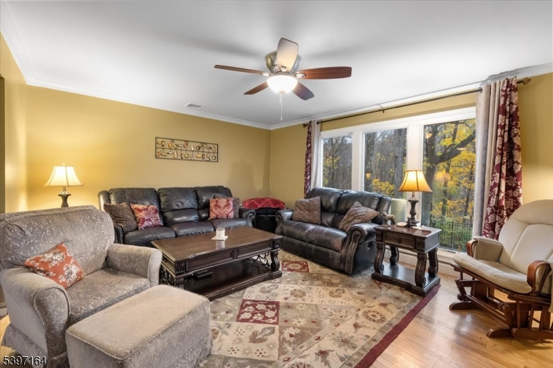 53 Pequot Road Ringwood, NJ 07456 - Photo 11 of 35 a living room with furniture and a large window