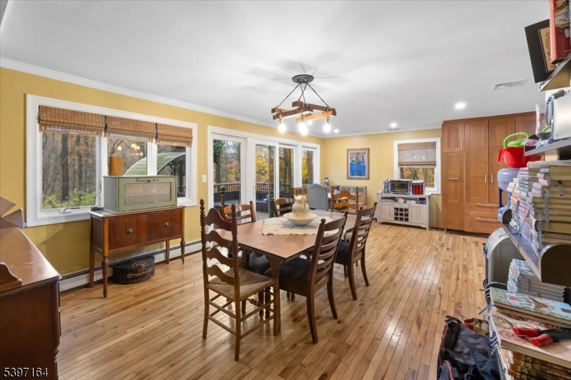 53 Pequot Road Ringwood, NJ 07456 - Photo 14 of 35 a view of a dining room with furniture window and wooden floor