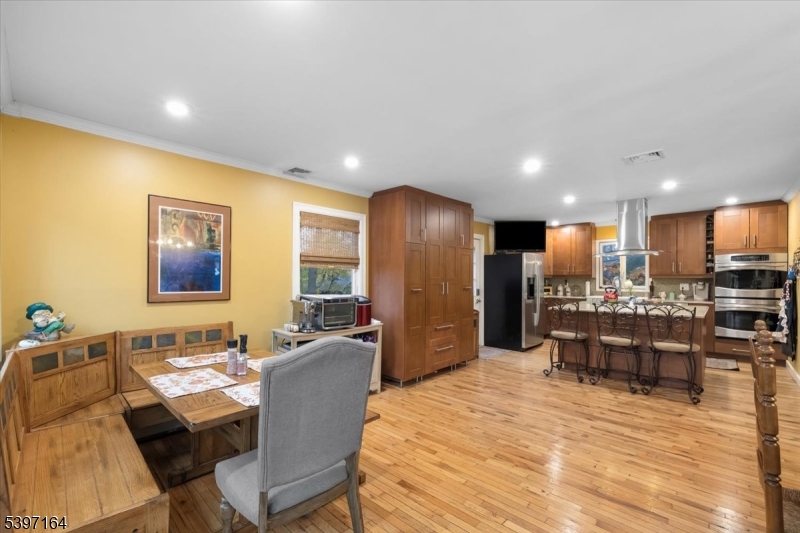 53 Pequot Road Ringwood, NJ 07456 - Photo 16 of 35 a large kitchen with a table and chairs