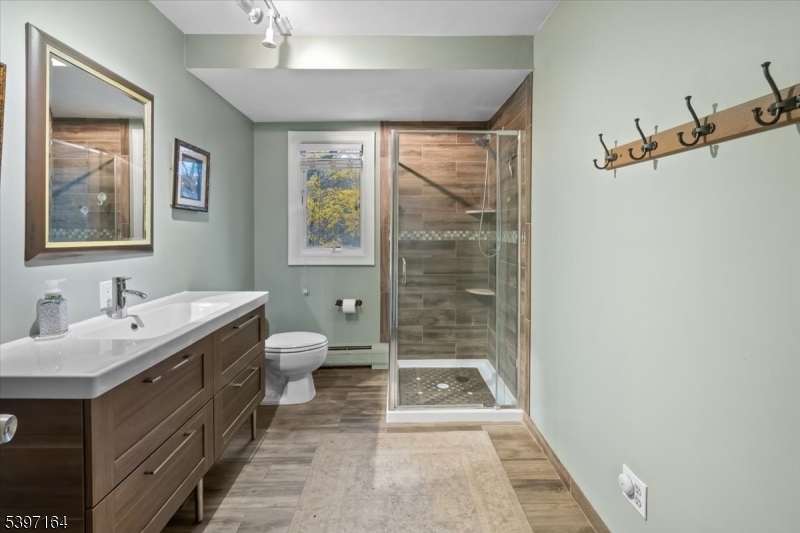 53 Pequot Road Ringwood, NJ 07456 - Photo 19 of 35 a spacious bathroom with a double vanity sink toilet and a mirror
