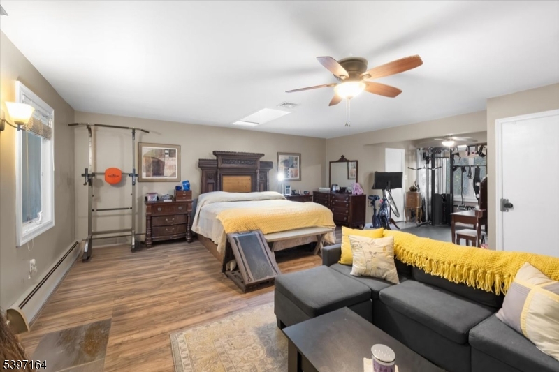 53 Pequot Road Ringwood, NJ 07456 - Photo 20 of 35 a bedroom with furniture and wooden floor