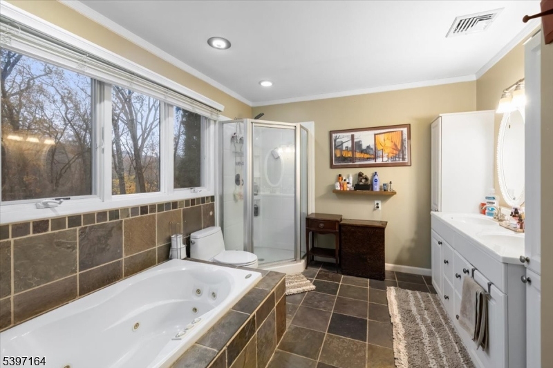 53 Pequot Road Ringwood, NJ 07456 - Photo 23 of 35 a bathroom with a bathtub sink and mirror