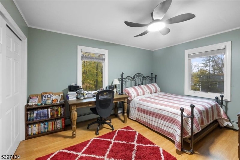 53 Pequot Road Ringwood, NJ 07456 - Photo 27 of 35 a bedroom with a bed wooden floor and window