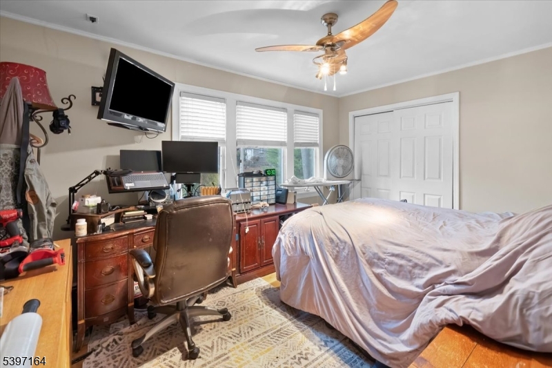 53 Pequot Road Ringwood, NJ 07456 - Photo 28 of 35 a bed room with a bed and a television