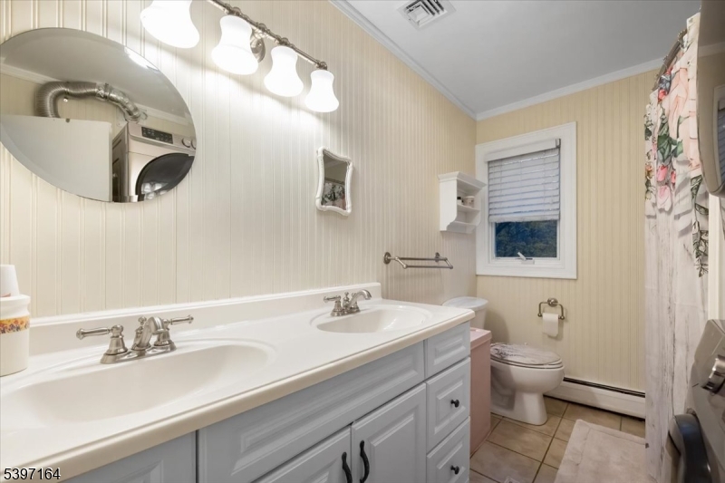 53 Pequot Road Ringwood, NJ 07456 - Photo 29 of 35 a bathroom with a granite countertop sink mirror and toilet