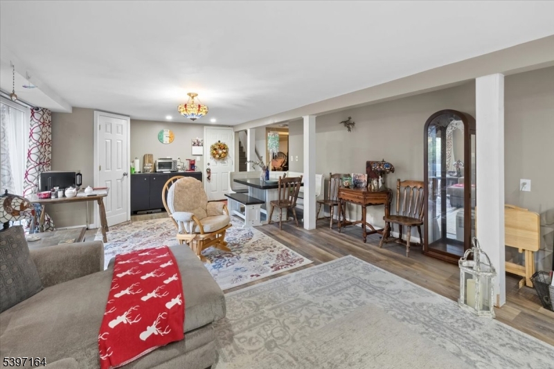 53 Pequot Road Ringwood, NJ 07456 - Photo 31 of 35 a living room with furniture and a chandelier