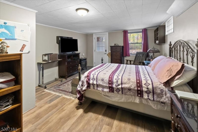 53 Pequot Road Ringwood, NJ 07456 - Photo 35 of 35 a bedroom with a bed and a flat screen tv